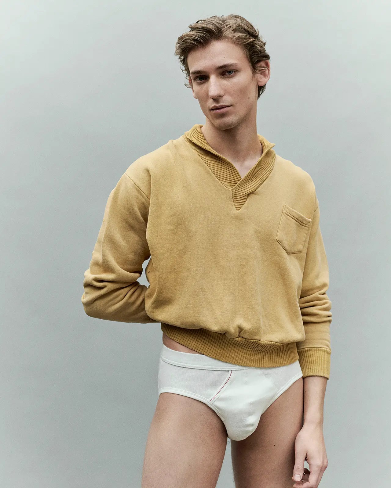 Man with sahara sweatshirt wearing the Etor off white organic cotton brief, made in Portugal | Hemen Biarritz