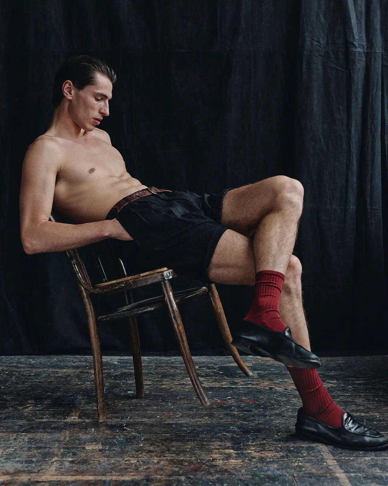 cotton underwear male | Man sitting balanced with his organic cotton red socks | HEMEN Biarritz | home